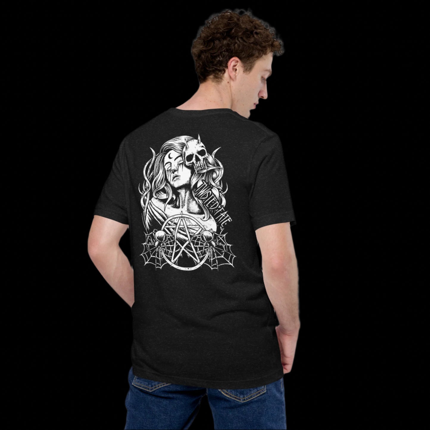 Person wearing a black t-shirt with a white graphic design on the back, standing