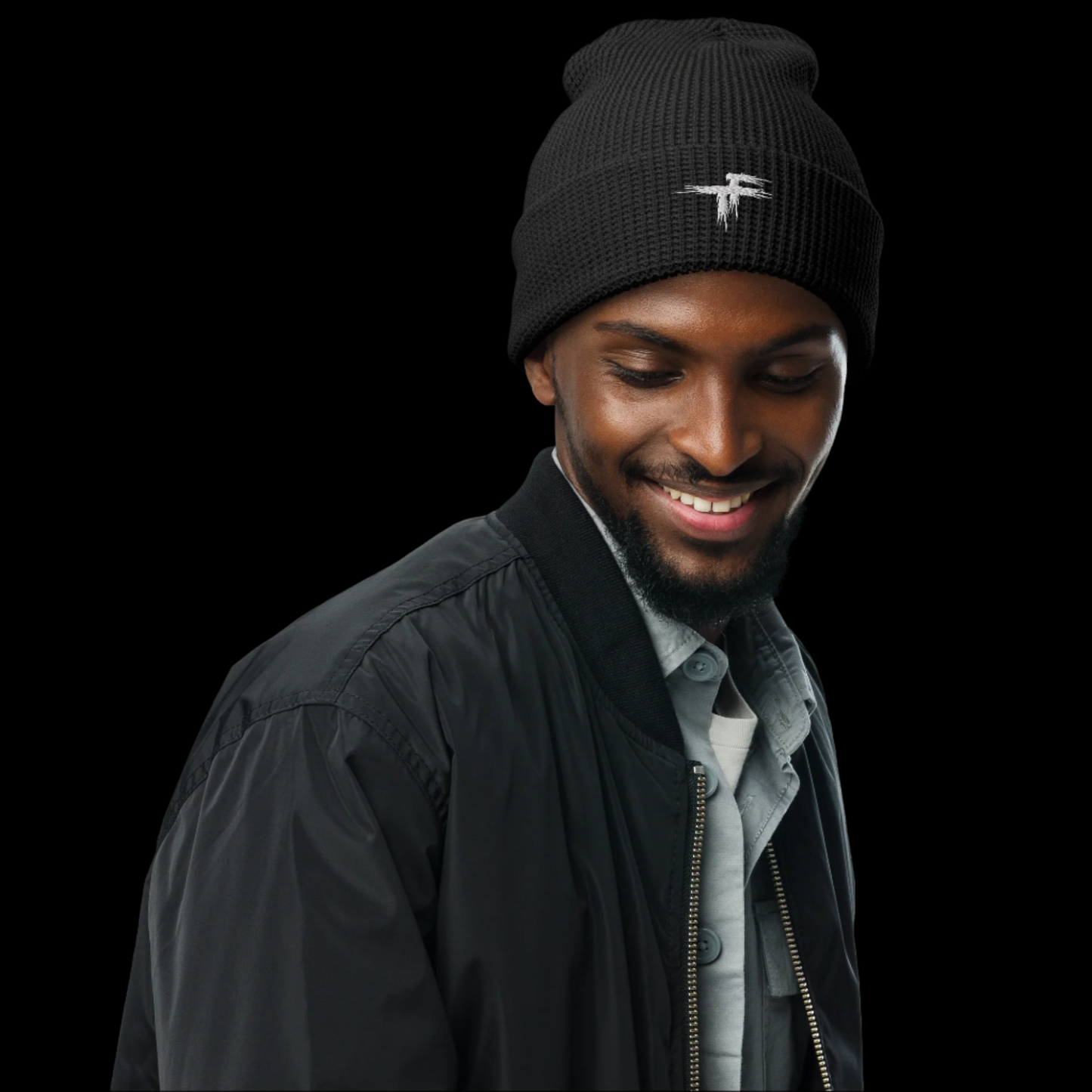 Man wearing a black beanie with a logo