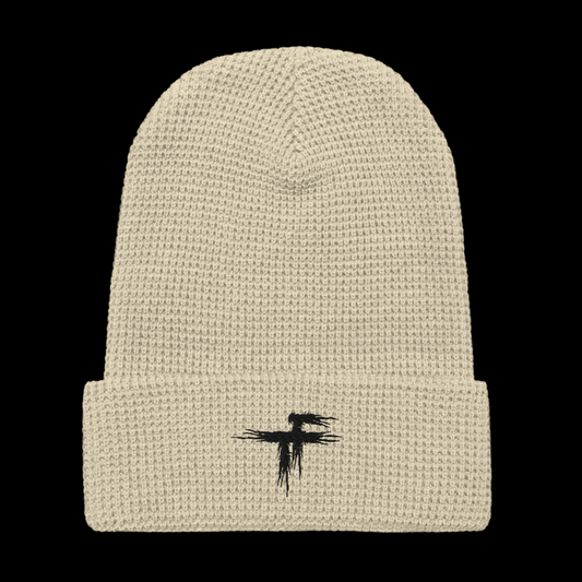 Beige knit beanie with a black logo 