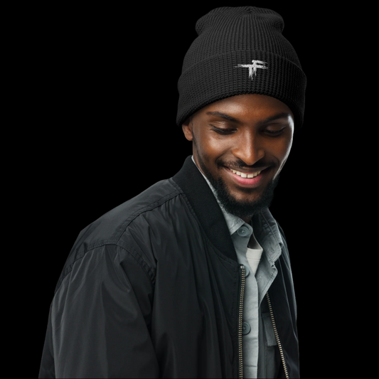 Man wearing a black beanie with a logo 